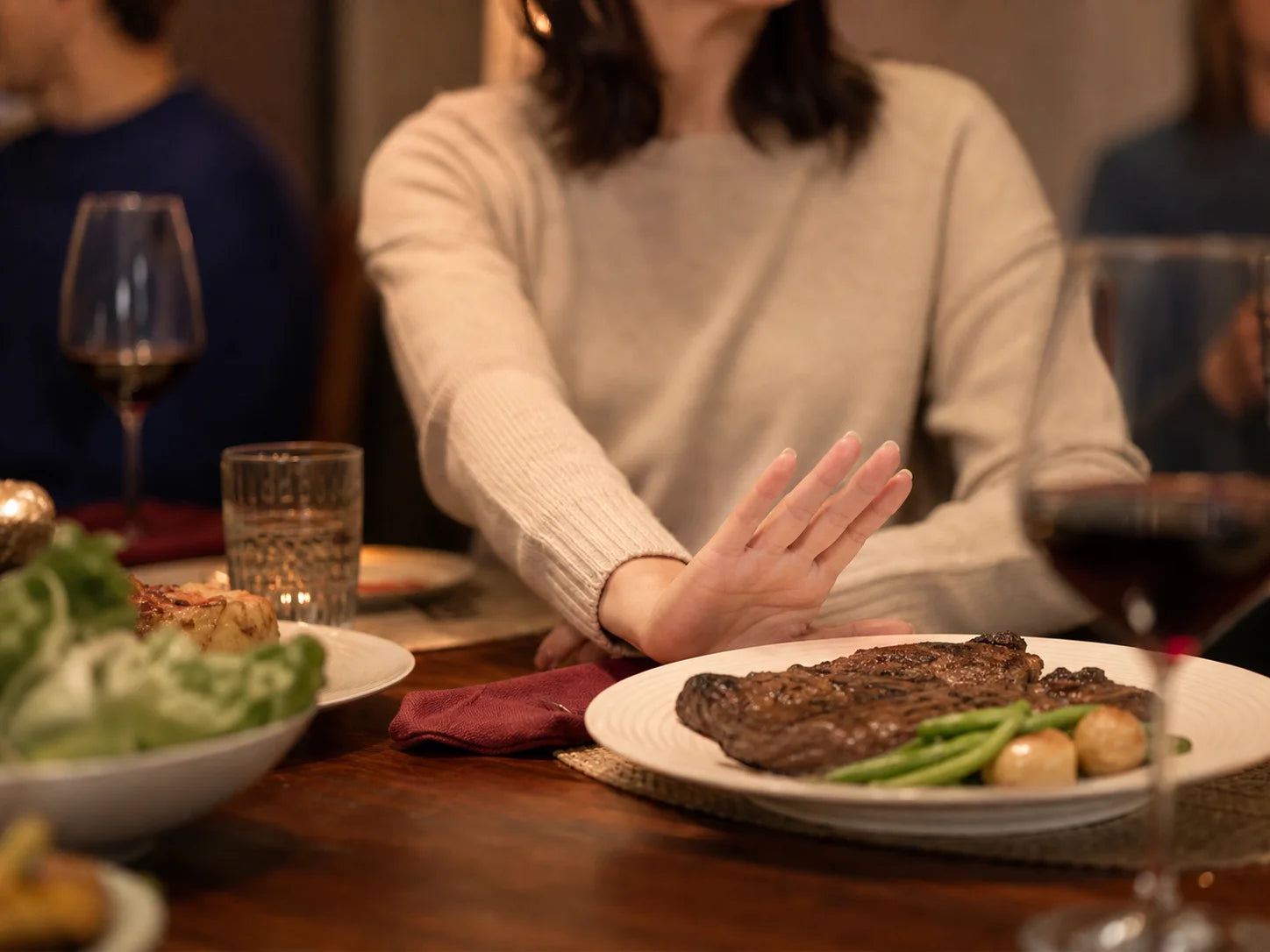 Editorial scene of a person declining a red-meat meal
